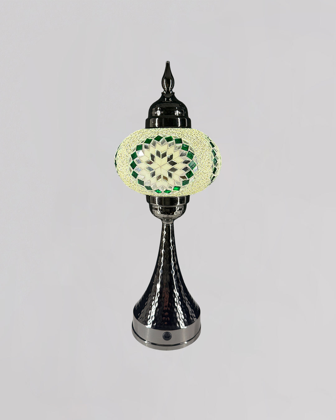 Decorative lamp with a green and white pattern on a gray background