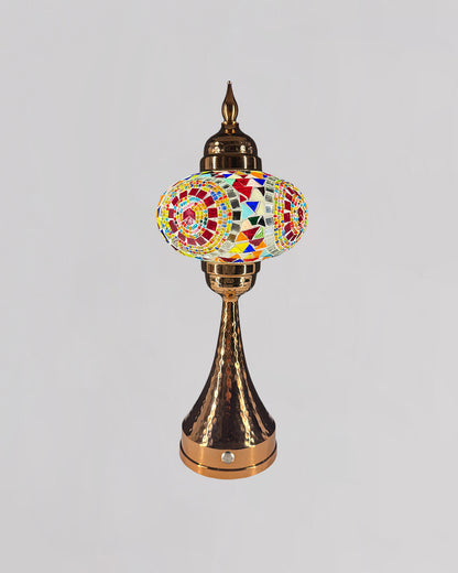 Decorative lamp with colorful mosaic design on a gray background