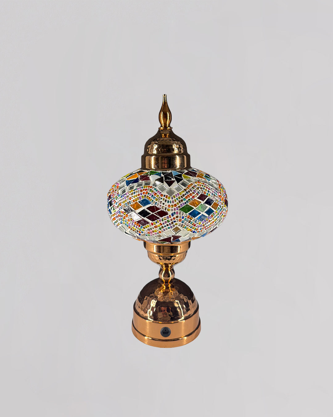 Decorative lamp with mosaic design on a gray background