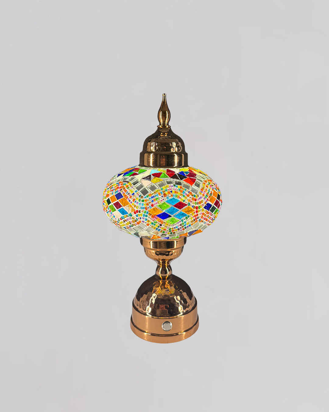Decorative lamp with colorful mosaic design on a gray background