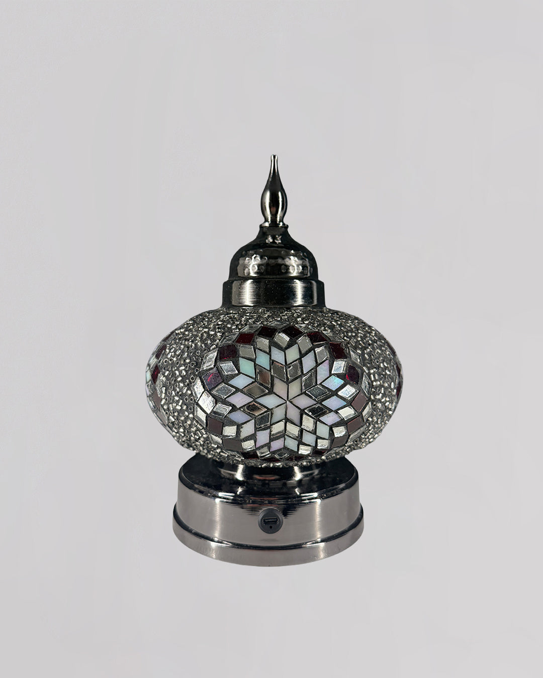 Decorative lamp with mosaic design on a white background