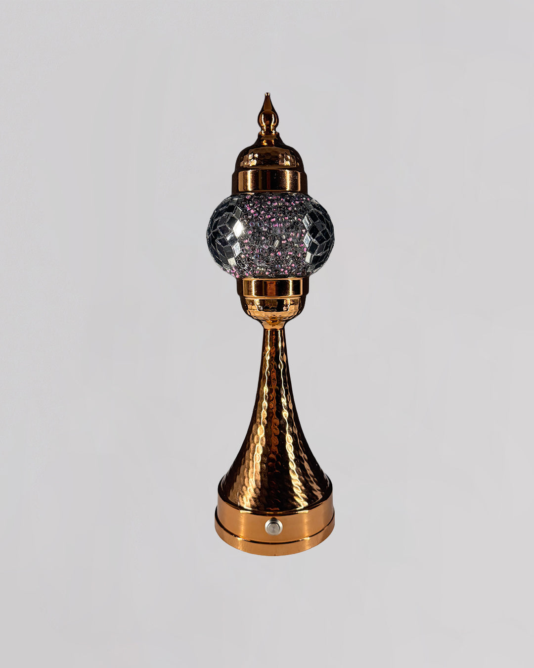 Decorative lamp with gold and crystal design on a light gray background