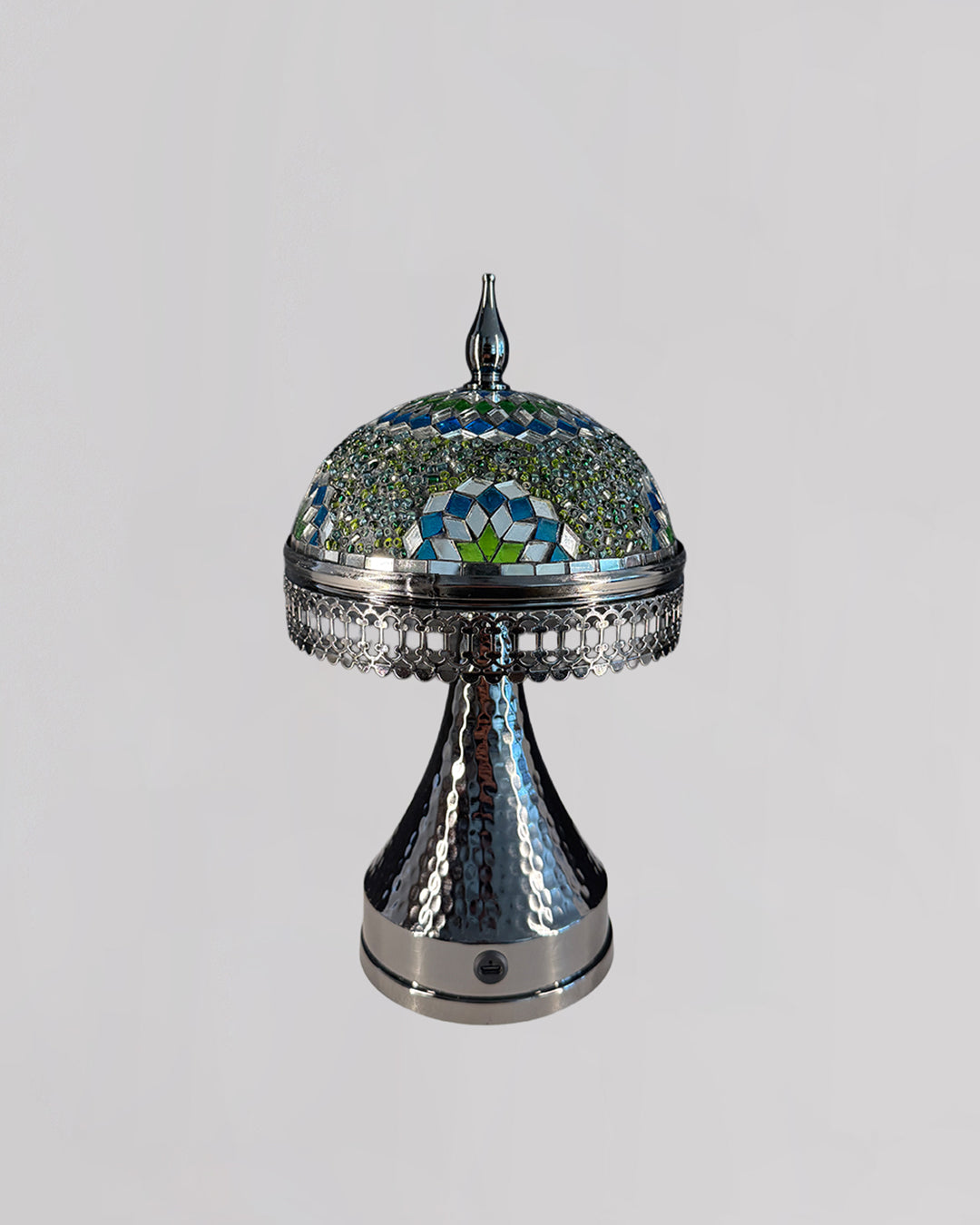 Decorative lamp with a mosaic top on a gray background