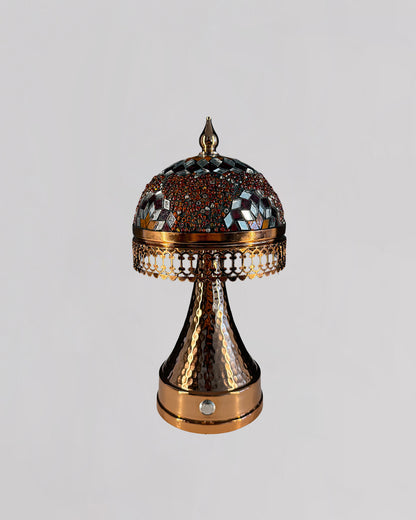 Decorative lamp with intricate design on a light gray background