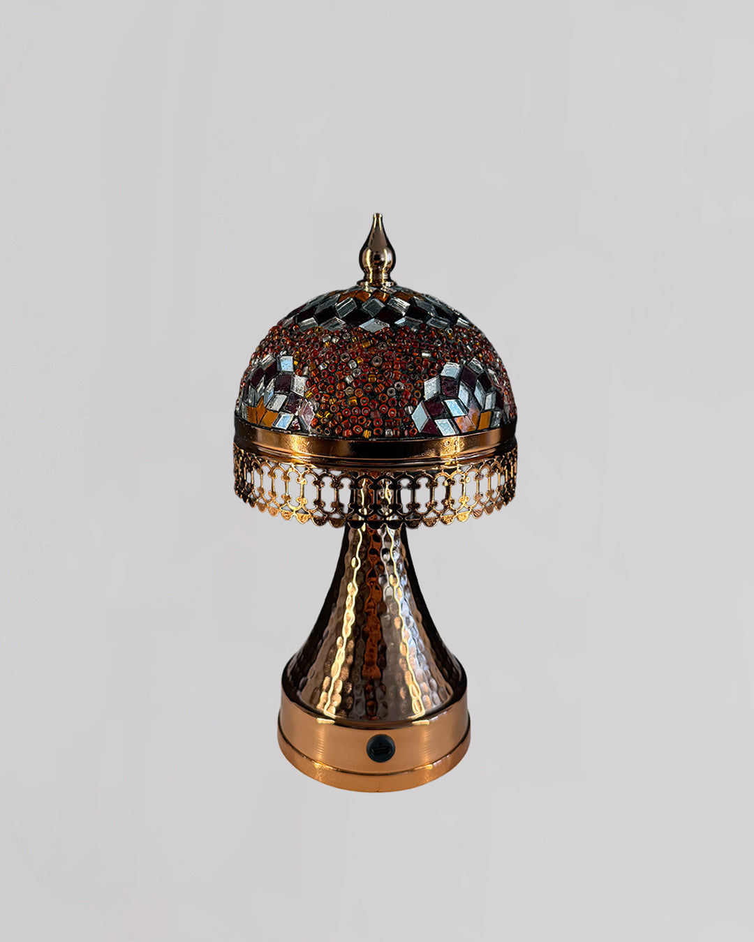 Decorative lamp with intricate design on a gray background