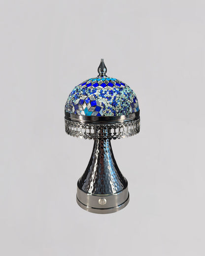 Decorative lamp with blue mosaic top on a gray background