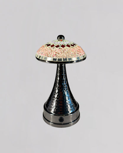 Decorative lamp with a colorful top and metallic base on a gray background